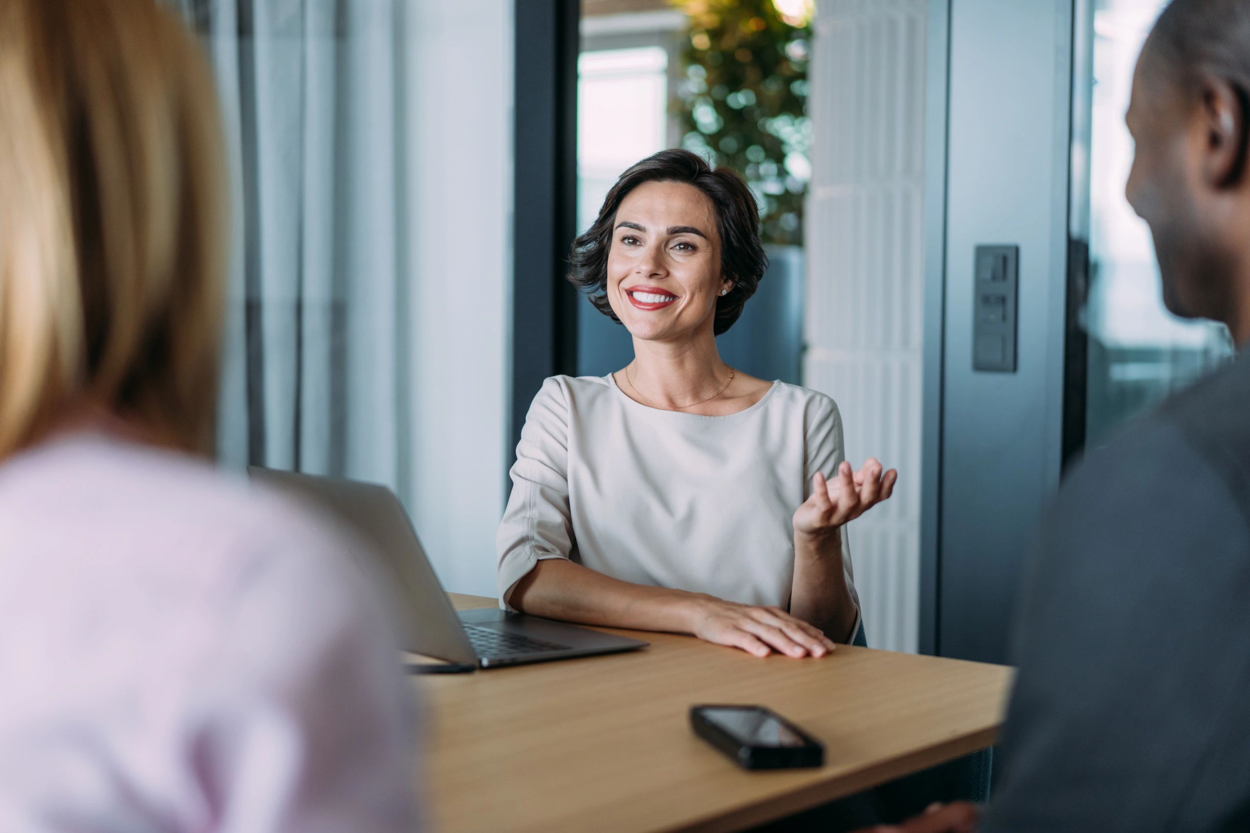 Professional woman in office meeting discussion